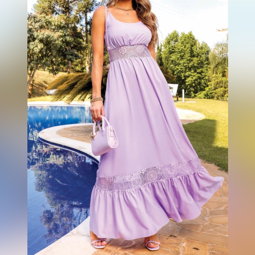 Lilac dress with lace details.